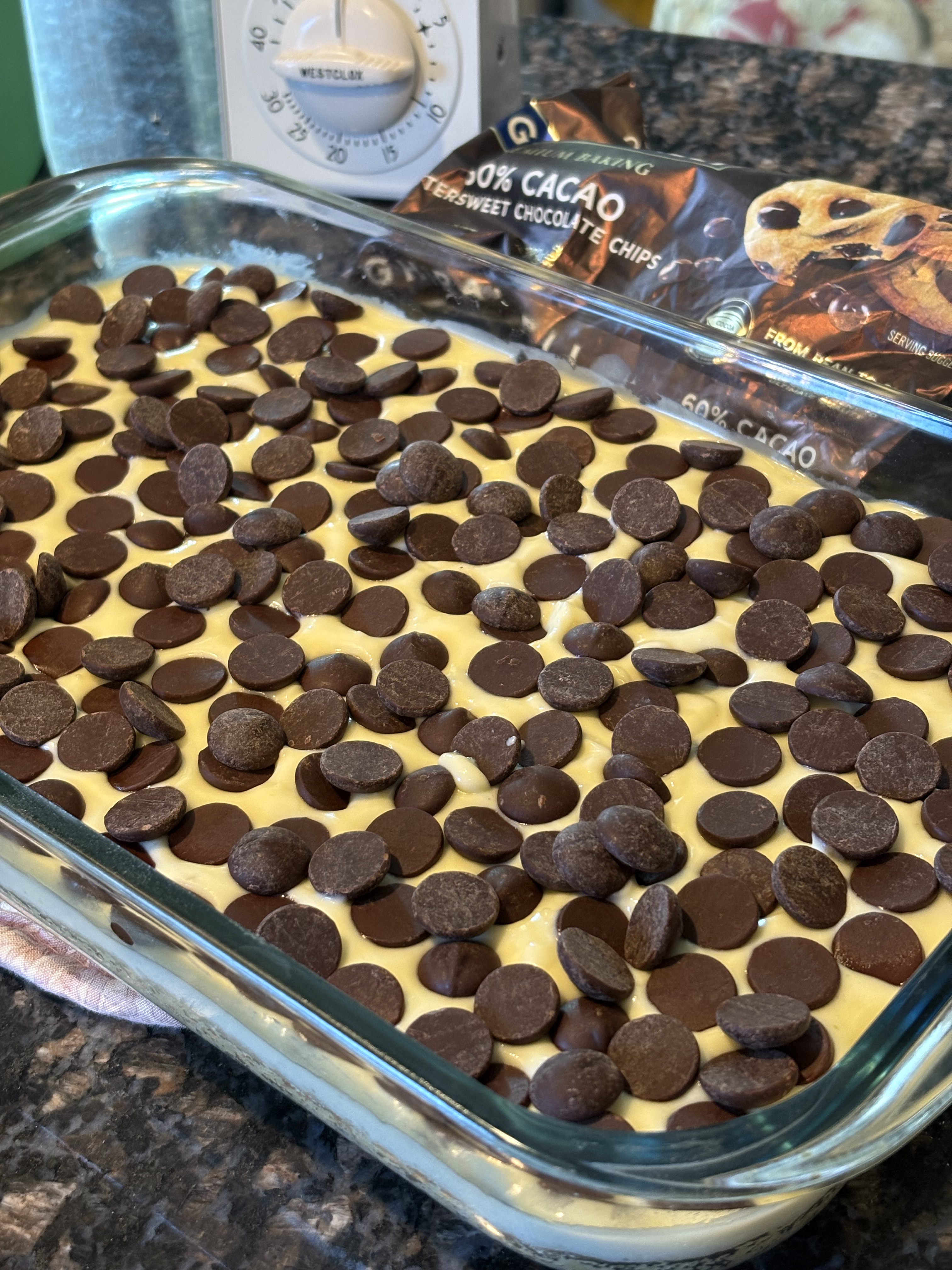 Chocolate chips scattered generously over cheesecake layer