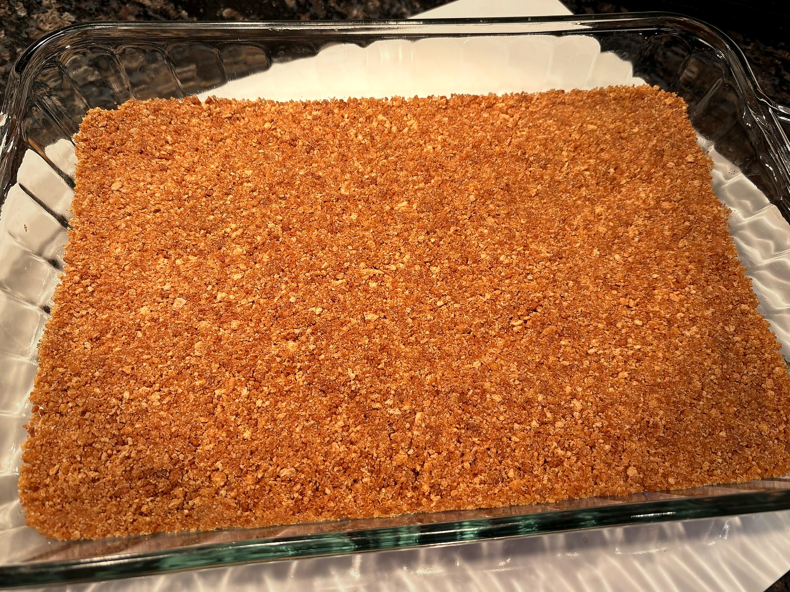 Cherry cheesecake filling spread over golden graham crust