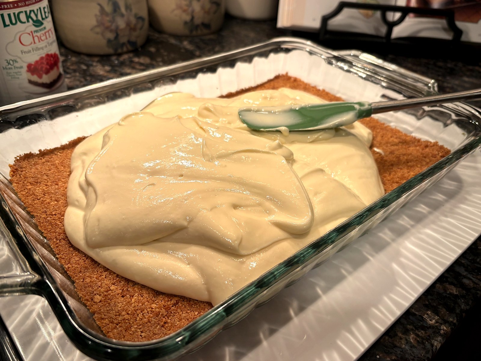 Cherry cheesecake batter layered onto crust with spatula
